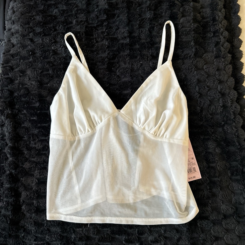 White mesh tank top with tie back 
Never worn 
Size small